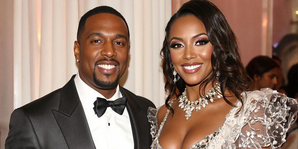 Sean Combs and his wife smiling at an event.