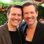 Pete Hegseth and spouse smiling at a public event.