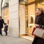wealthy shoppers spend others struggle