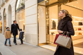 wealthy shoppers spend others struggle